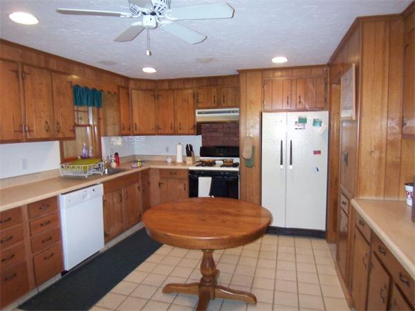 2-4 Evergreen Avenue Newton, MA 02466 - Photo 15 of 23 a kitchen with stainless steel appliances a refrigerator sink and cabinets