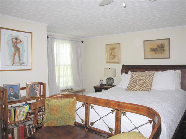 2-4 Evergreen Avenue Newton, MA 02466 - Photo 7 of 23 a bed room with a bed and a book shelf