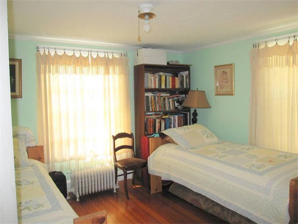 2-4 Evergreen Avenue Newton, MA 02466 - Photo 8 of 23 a bedroom with a bed furniture and a window