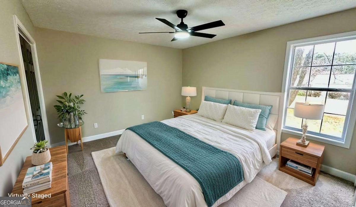 2095 4 Notch Road Carrollton, GA 30116 - Photo 27 of 53 a bedroom with a bed and a large window