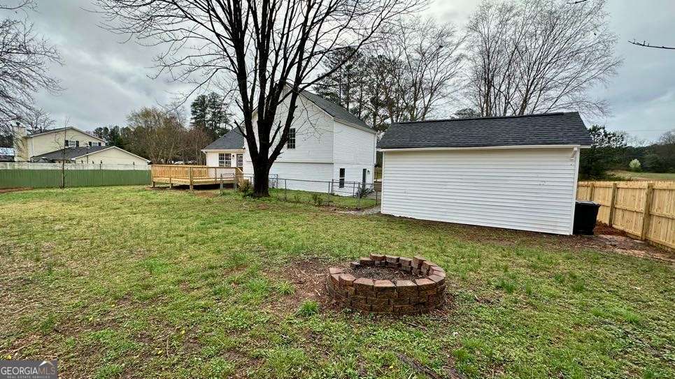 2095 4 Notch Road Carrollton, GA 30116 - Photo 52 of 53 a view of a backyard with a garden and trees