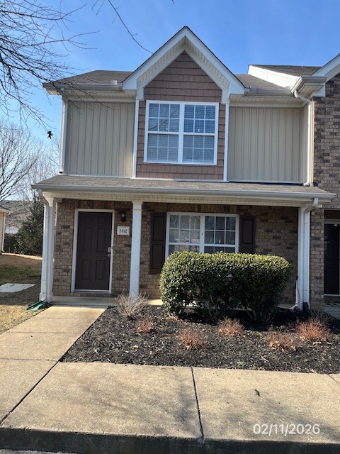 2012 Victory Gallop Lane Murfreesboro, TN 37128 - Photo 1 of 2 a front view of a house with a garden