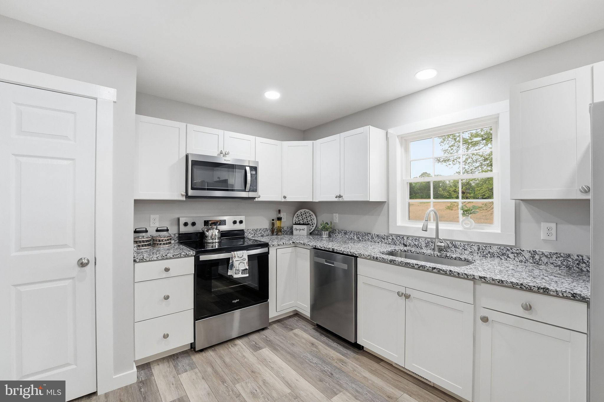 14006 Rixeyville Road Culpeper, VA 22701 - Photo 15 of 36 Modern kitchen with sleek finishes.