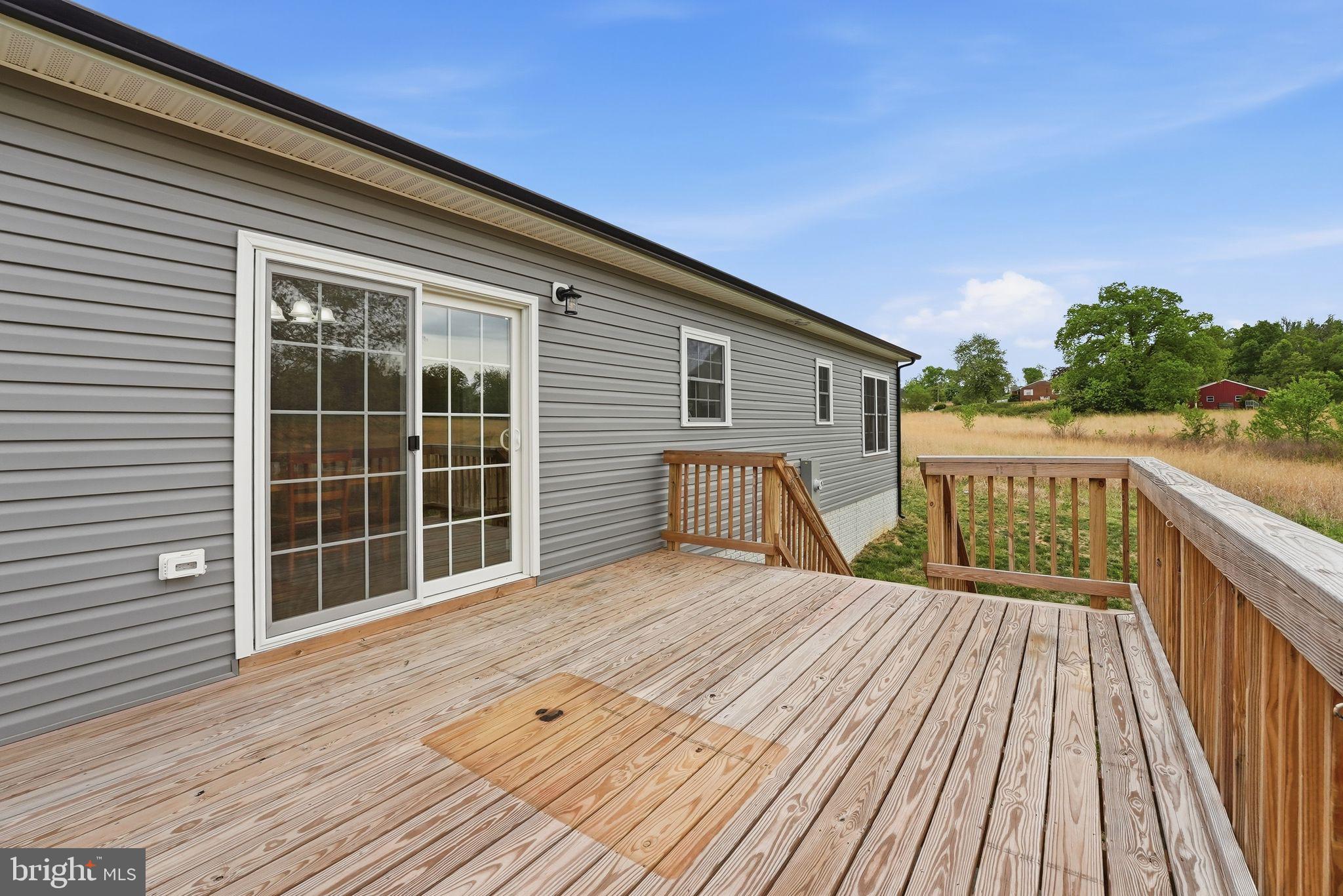 14006 Rixeyville Road Culpeper, VA 22701 - Photo 31 of 36 Spacious deck with serene views.