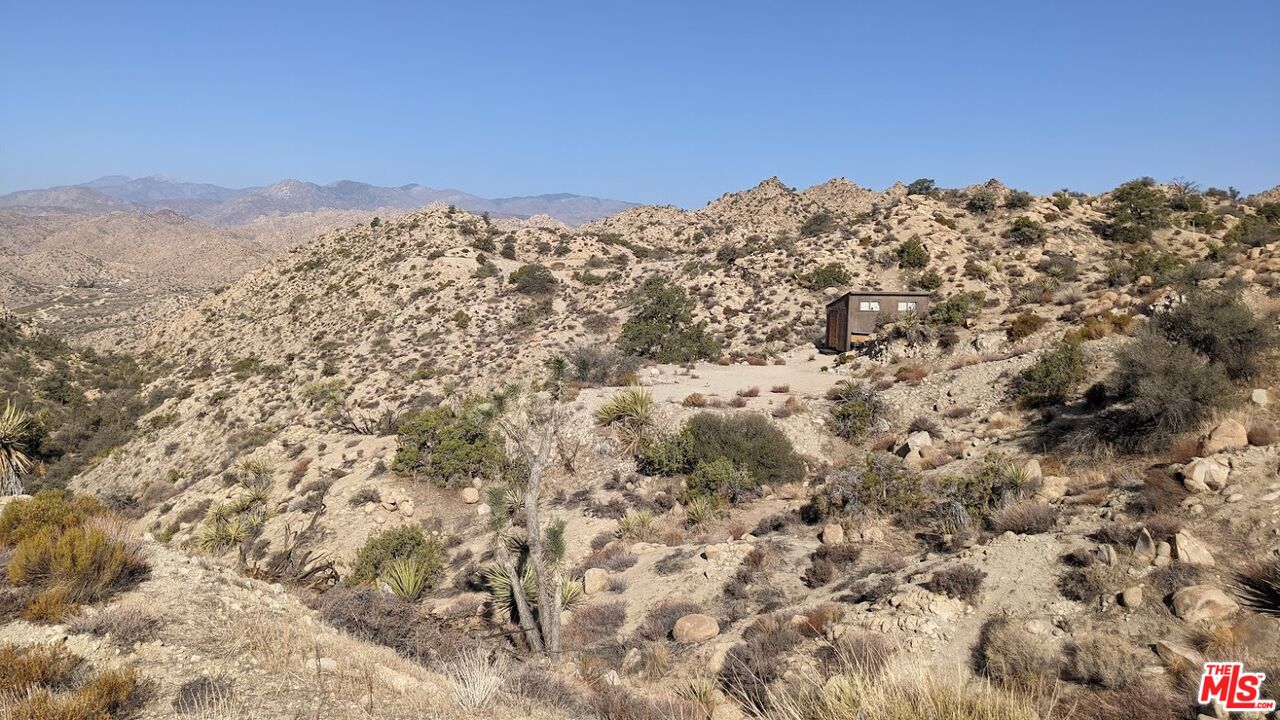 20 West Omega Trail Yucca Valley, CA 92284 - Photo 11 of 32 a view of a large building with mountains in the background