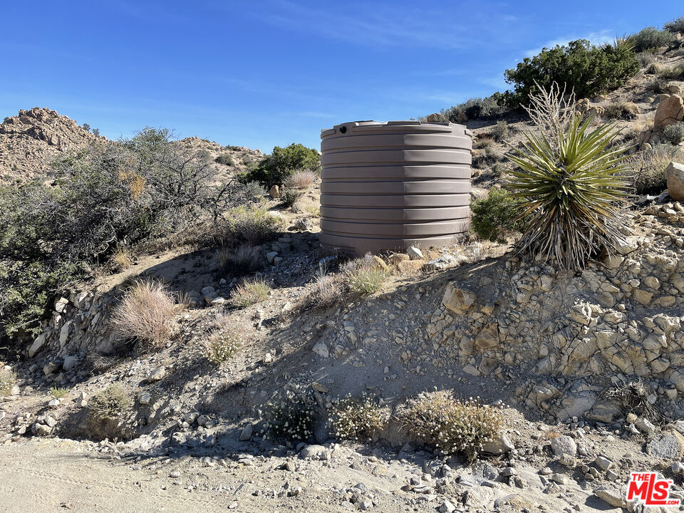 20 West Omega Trail Yucca Valley, CA 92284 - Photo 16 of 32 a view of a dry yard with a mountain view