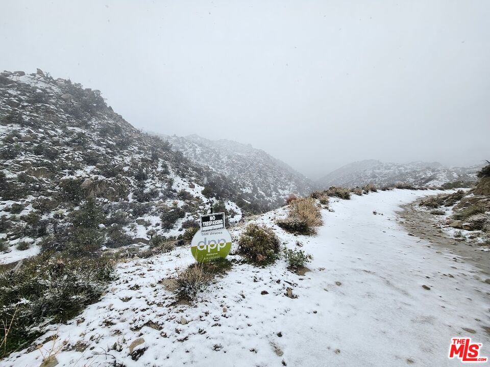 20 West Omega Trail Yucca Valley, CA 92284 - Photo 32 of 32 a view of a dry yard with wooden fence