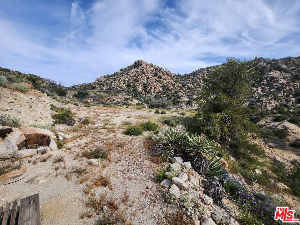 20 West Omega Trail Yucca Valley, CA 92284 - Photo 6 of 32 a view of a large building with mountains in the background