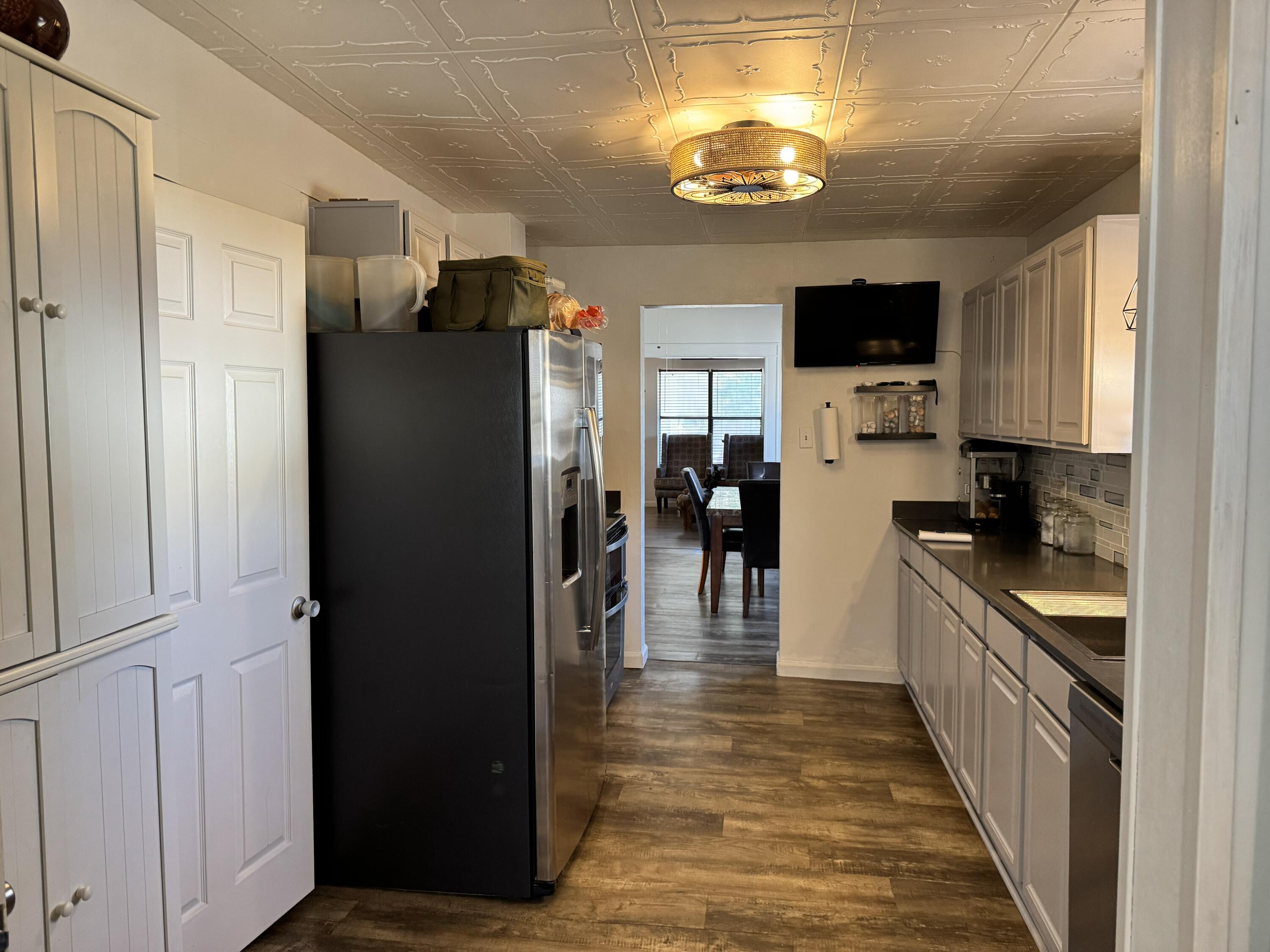 2864 Sixth Street Florala, AL 36442 - Photo 13 of 28 a kitchen with stainless steel appliances granite countertop a refrigerator a stove and a sink