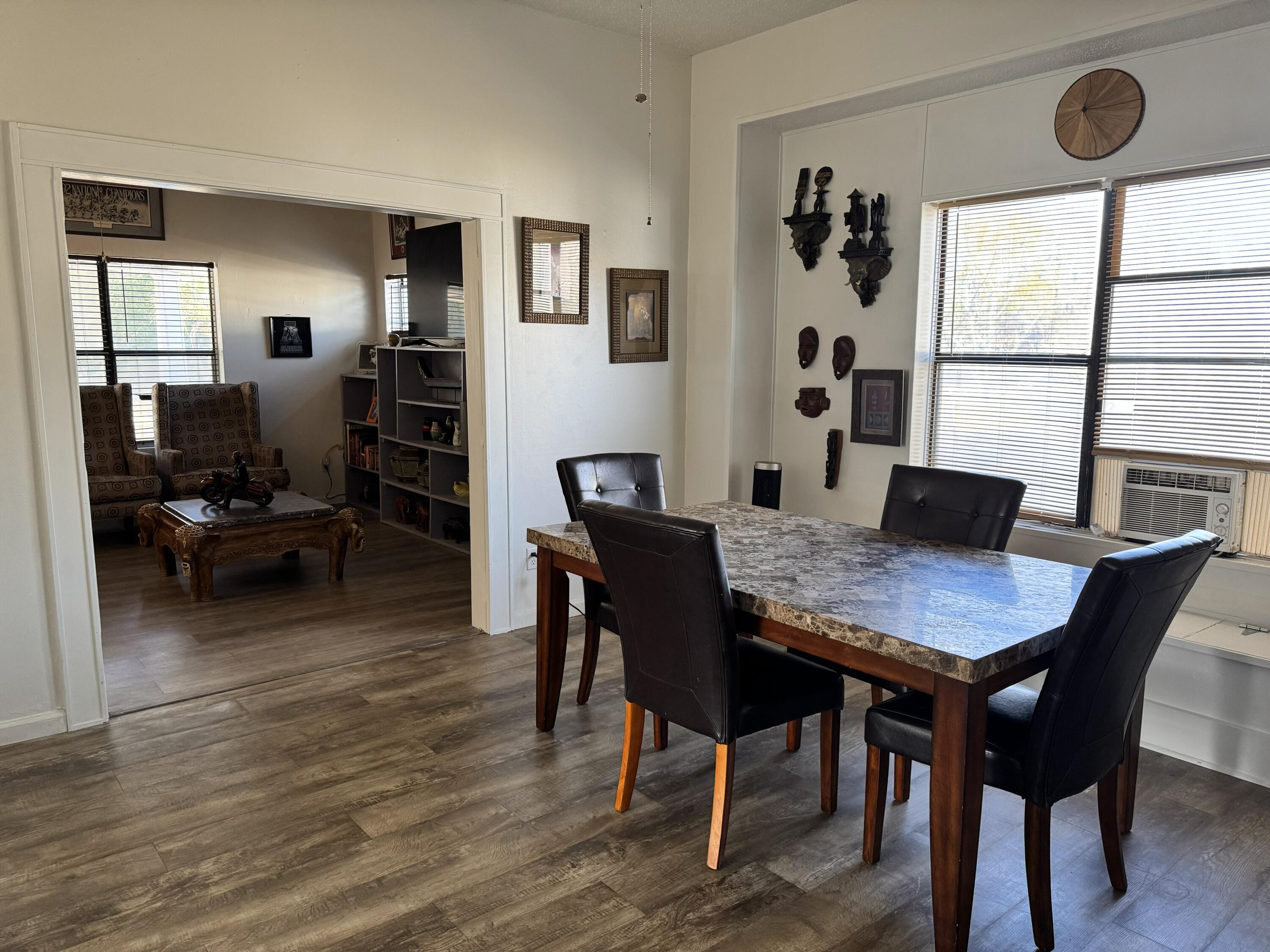 2864 Sixth Street Florala, AL 36442 - Photo 4 of 28 a view of a dining room with furniture and wooden floor