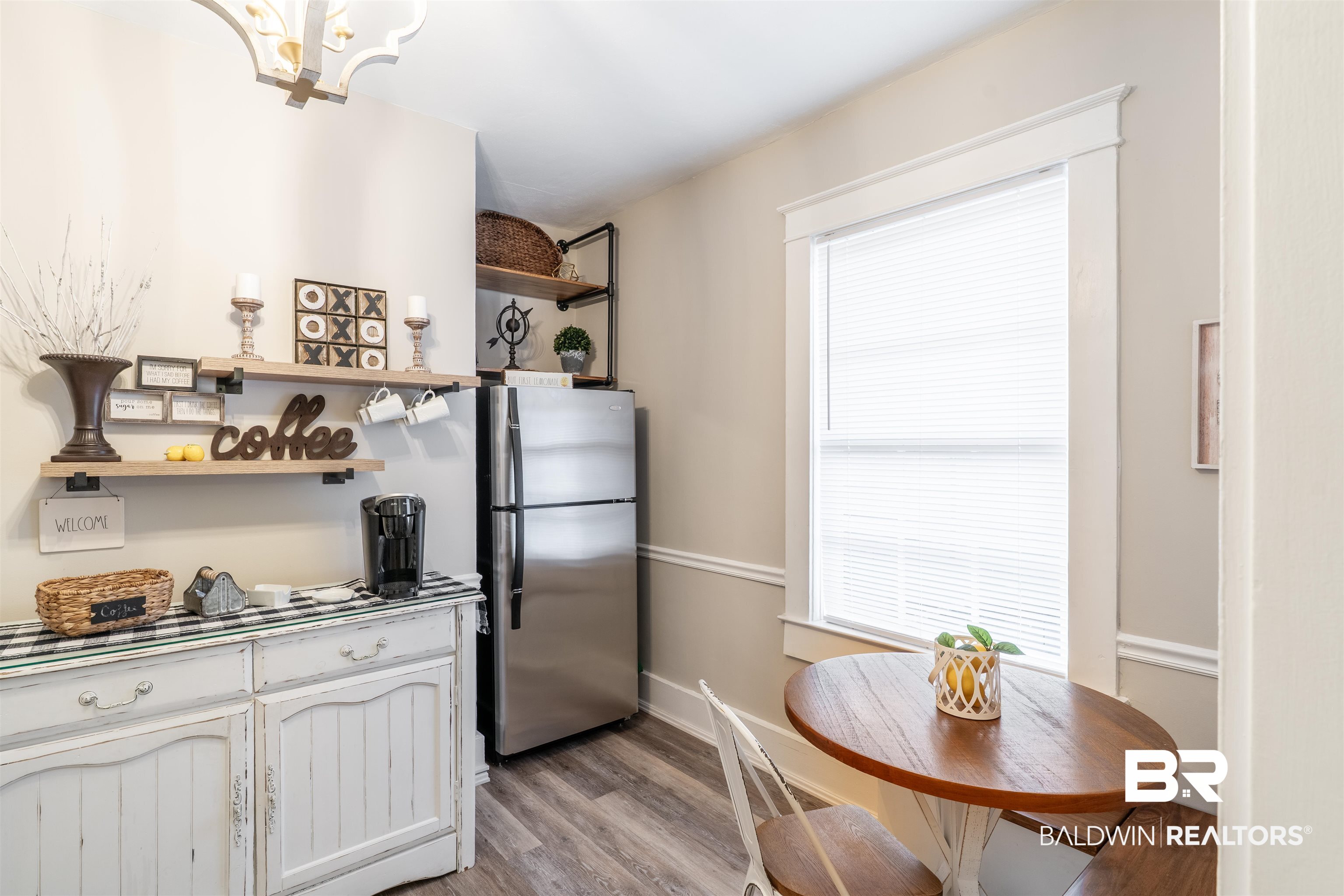 1600 Government Street, Unit 3F Mobile, AL 36604 - Photo 14 of 18 Kitchen with open shelves, freestanding refrigerator, and light wood finished floors