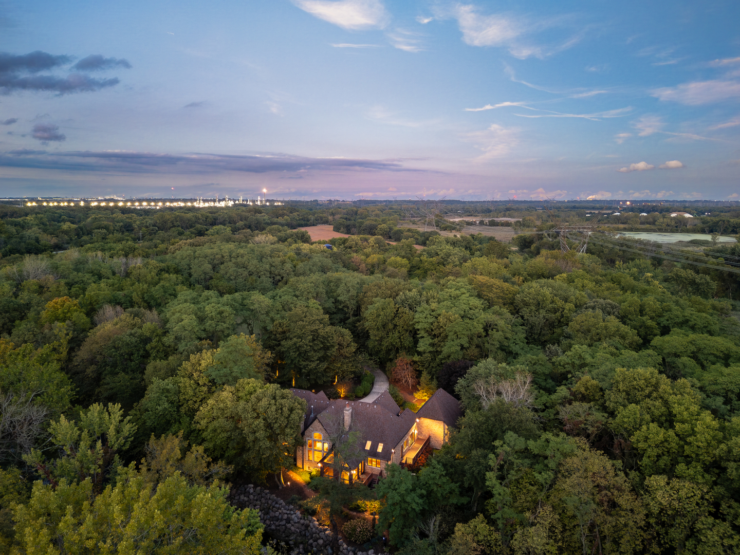 an aerial view of a houses with a yard