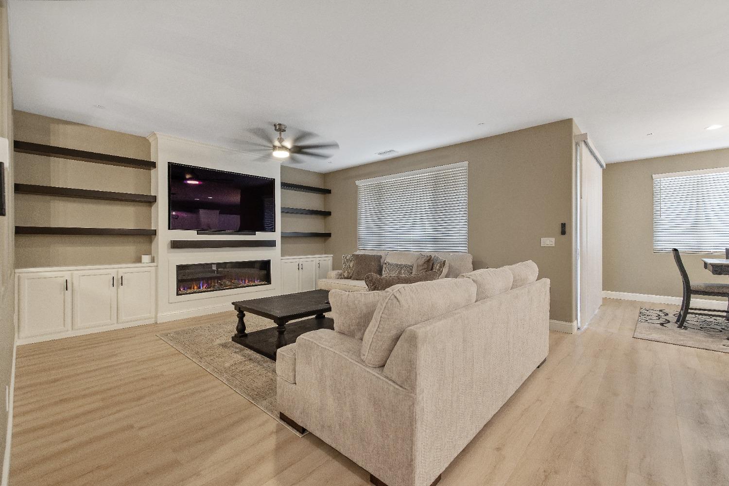 1210 Ridge Creek Estates Way Dinuba, CA 93618 - Photo 16 of 50 a living room with furniture and a flat screen tv