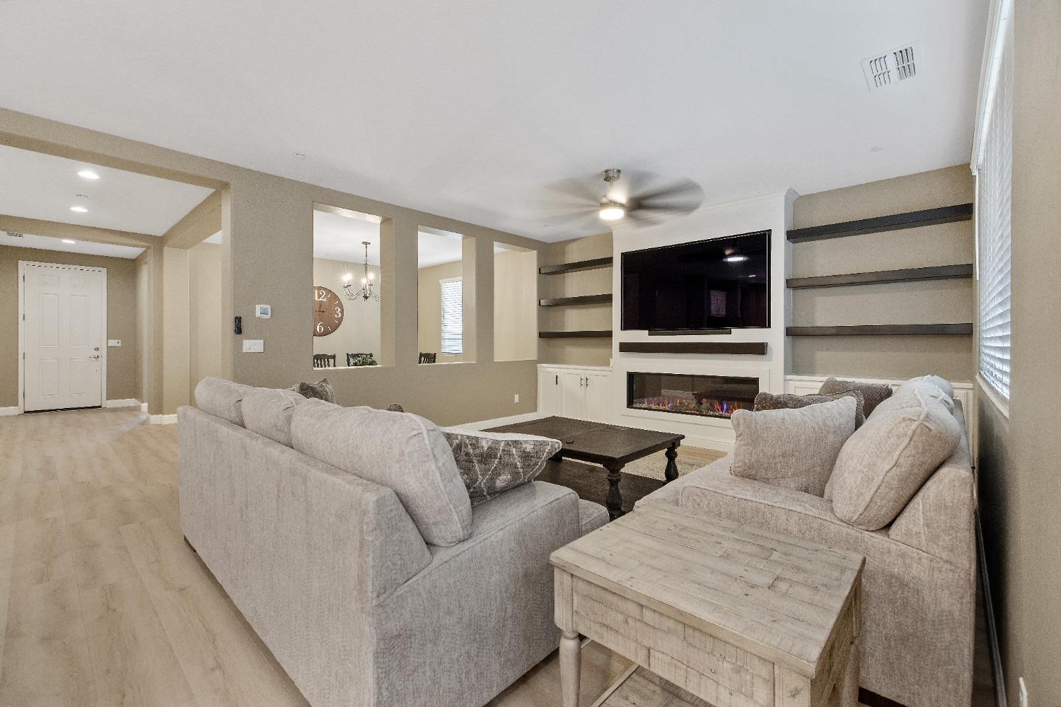 1210 Ridge Creek Estates Way Dinuba, CA 93618 - Photo 17 of 50 a living room with furniture and a flat screen tv