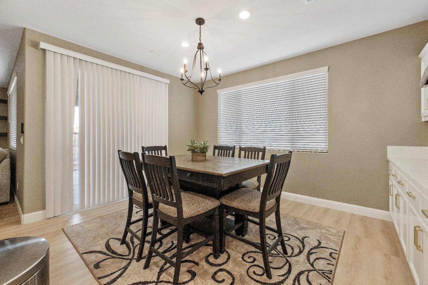 1210 Ridge Creek Estates Way Dinuba, CA 93618 - Photo 29 of 50 a view of a dining room with furniture and window