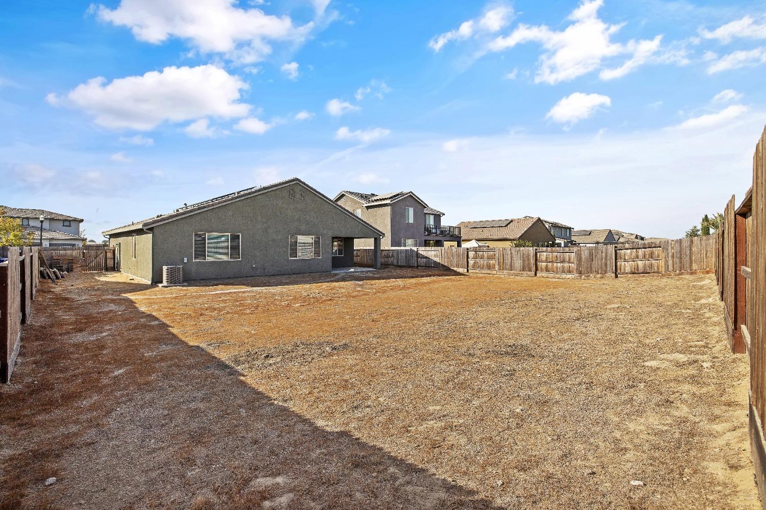 1210 Ridge Creek Estates Way Dinuba, CA 93618 - Photo 47 of 50 a view of houses with sky view