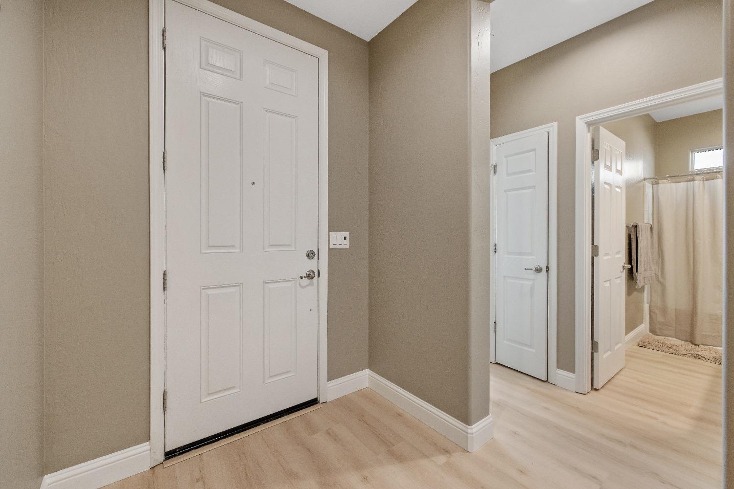 1210 Ridge Creek Estates Way Dinuba, CA 93618 - Photo 5 of 50 an empty room with closet and mirror