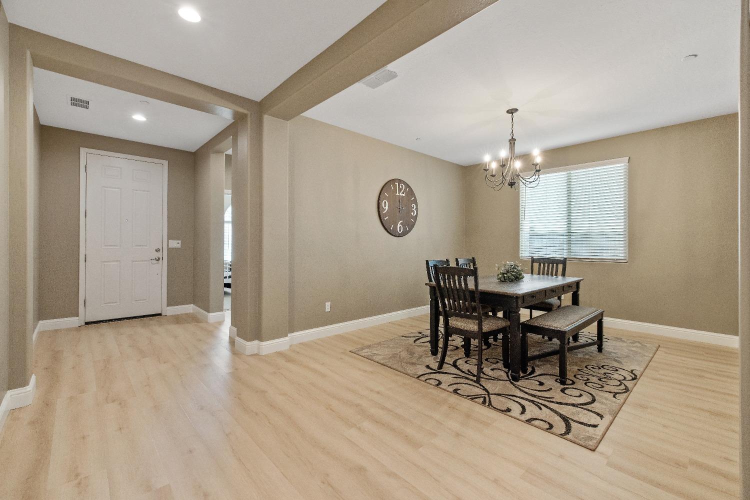 1210 Ridge Creek Estates Way Dinuba, CA 93618 - Photo 10 of 50 a view of a dining room with furniture and window