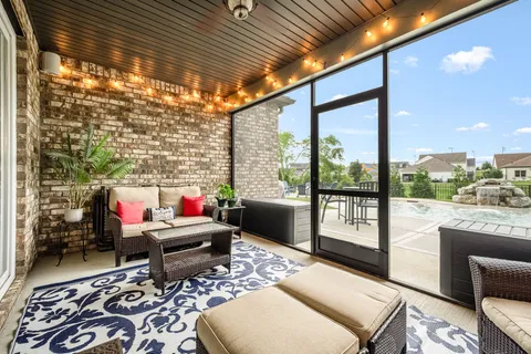 a living room filled with furniture and a table