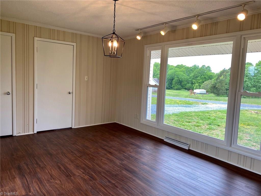 5458 Jesse Small Road Randleman, NC 27317 - Photo 16 of 30 Beautiful formal dining room with large picture window and double doors leading out onto the back deck!
