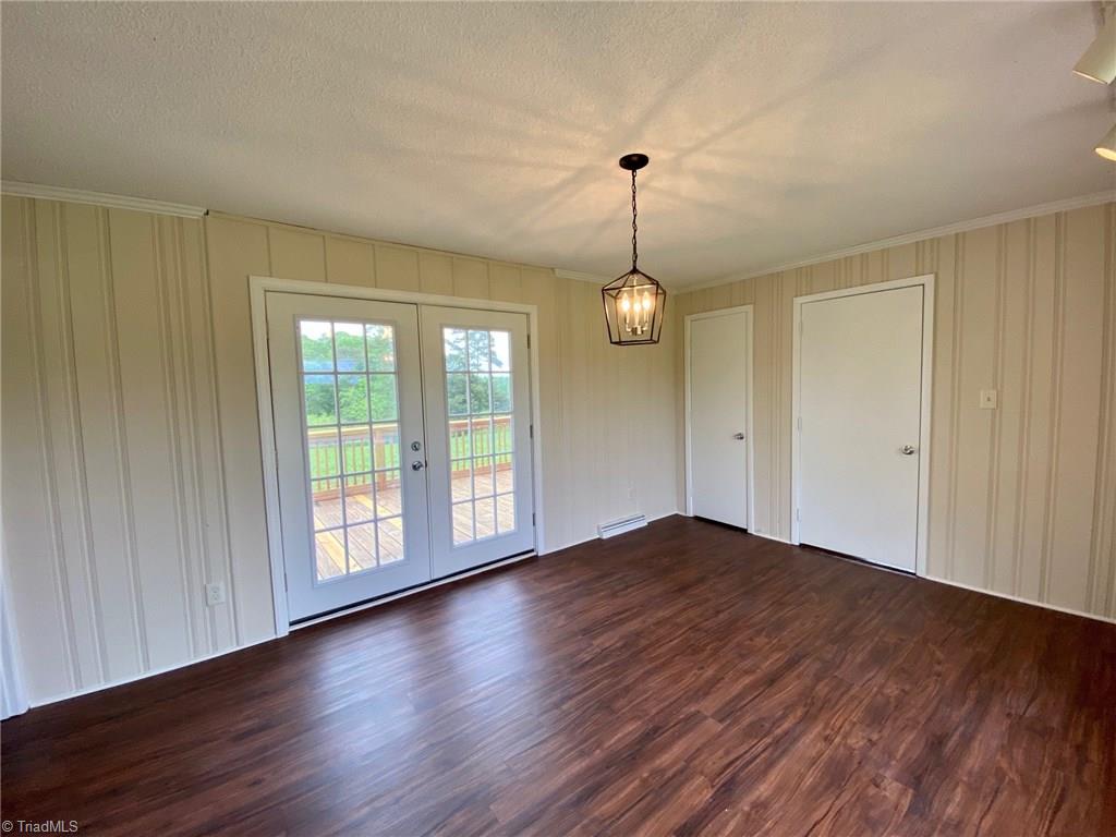5458 Jesse Small Road Randleman, NC 27317 - Photo 17 of 30 Dining room back door with views of the fields and water!