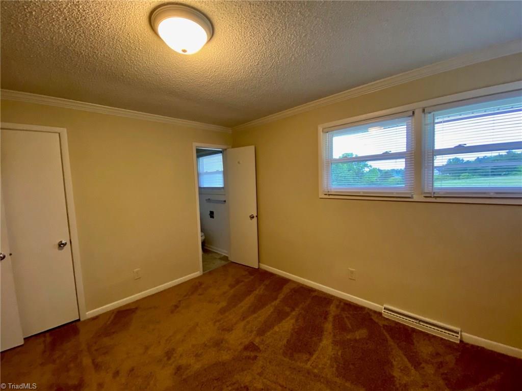 5458 Jesse Small Road Randleman, NC 27317 - Photo 23 of 30 Master bedroom with attached bath