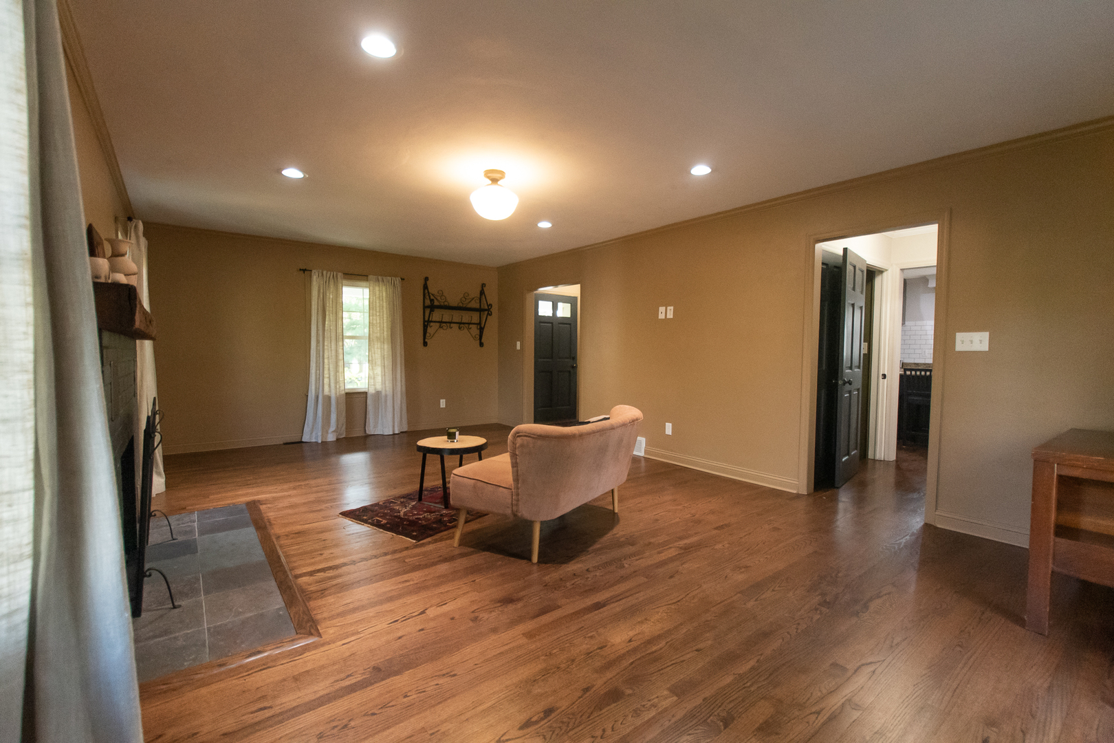 3868 Ogle Street Dixon, IL 61021 - Photo 26 of 49 a view of a big room with wooden floor and a refrigerator