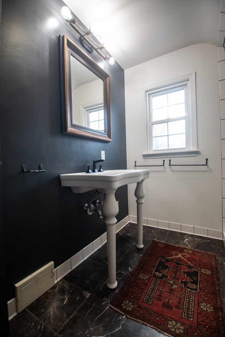 3868 Ogle Street Dixon, IL 61021 - Photo 34 of 49 a bathroom with a sink toilet and mirror