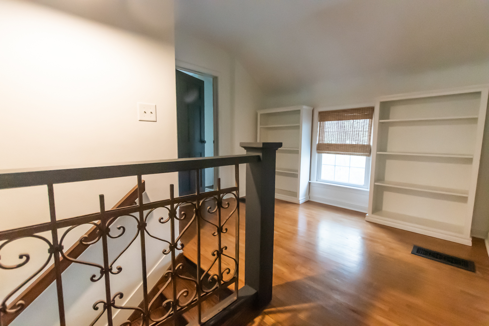 3868 Ogle Street Dixon, IL 61021 - Photo 43 of 49 a view of a hallway with wooden floor and staircase