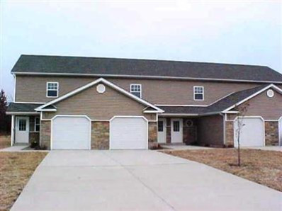 a front view of a house with garage