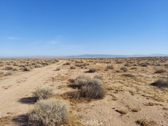 5 Harper Lake Road Hinkley, CA 92347 - Photo 2 of 4 a view of empty room with wooden floor