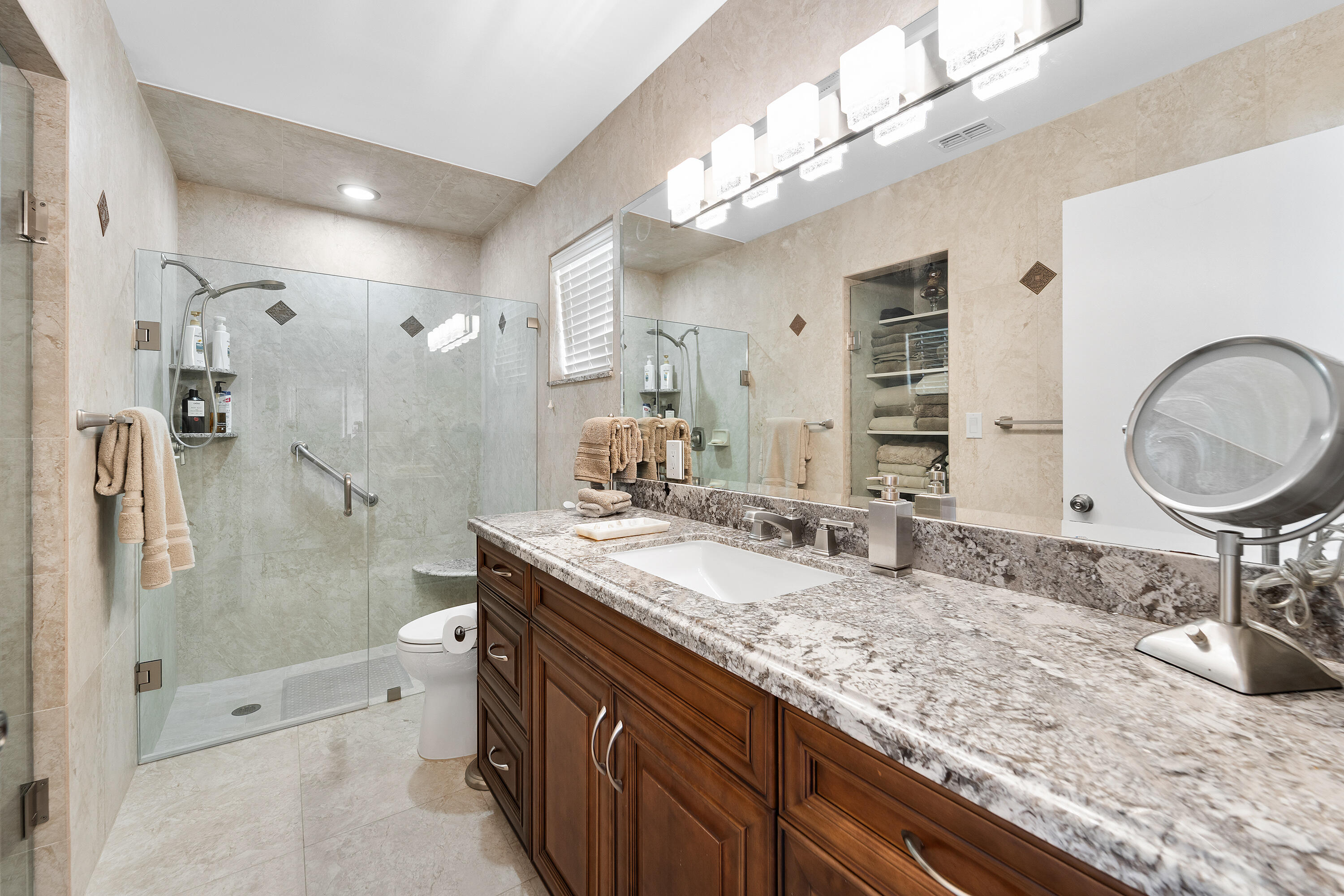 6339 Mill Pointe Circle Delray Beach, FL 33484 - Photo 24 of 61 a bathroom with a granite countertop double vanity sink mirror and shower