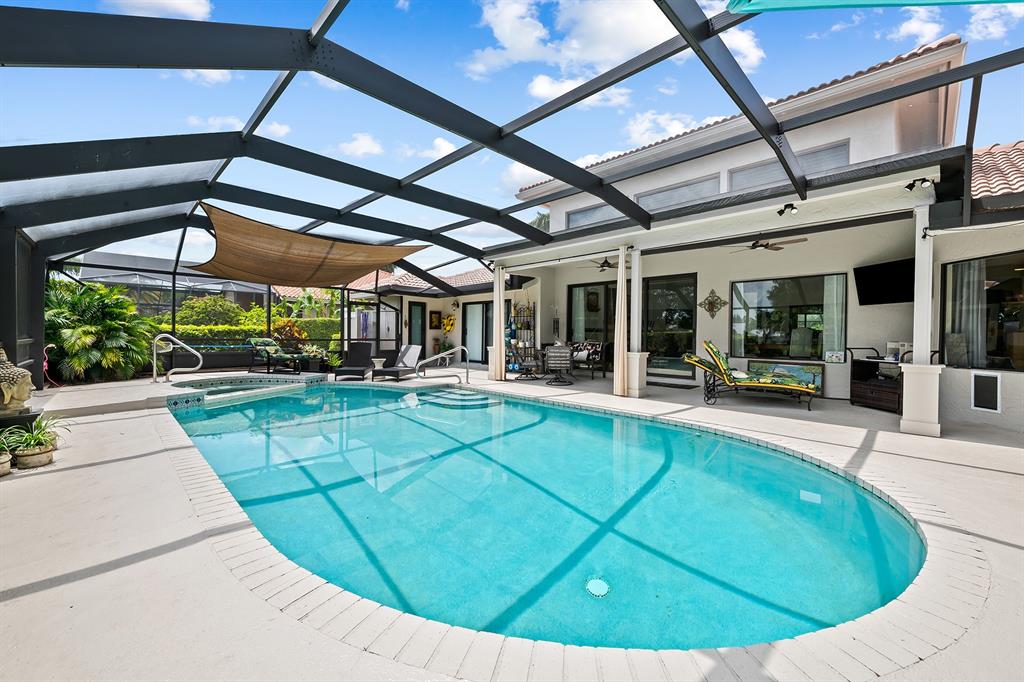 10270 Silver Lake Drive Boca Raton, FL 33428 - Photo 24 of 44 a view of a swimming pool with a patio