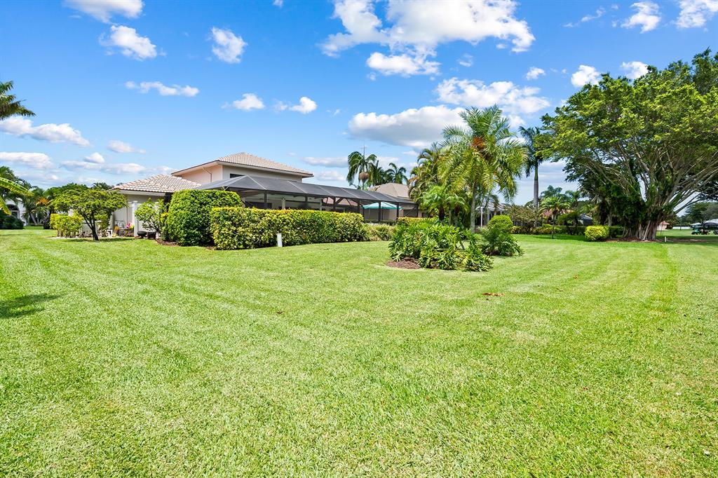 10270 Silver Lake Drive Boca Raton, FL 33428 - Photo 29 of 44 a view of a garden with a building in the background