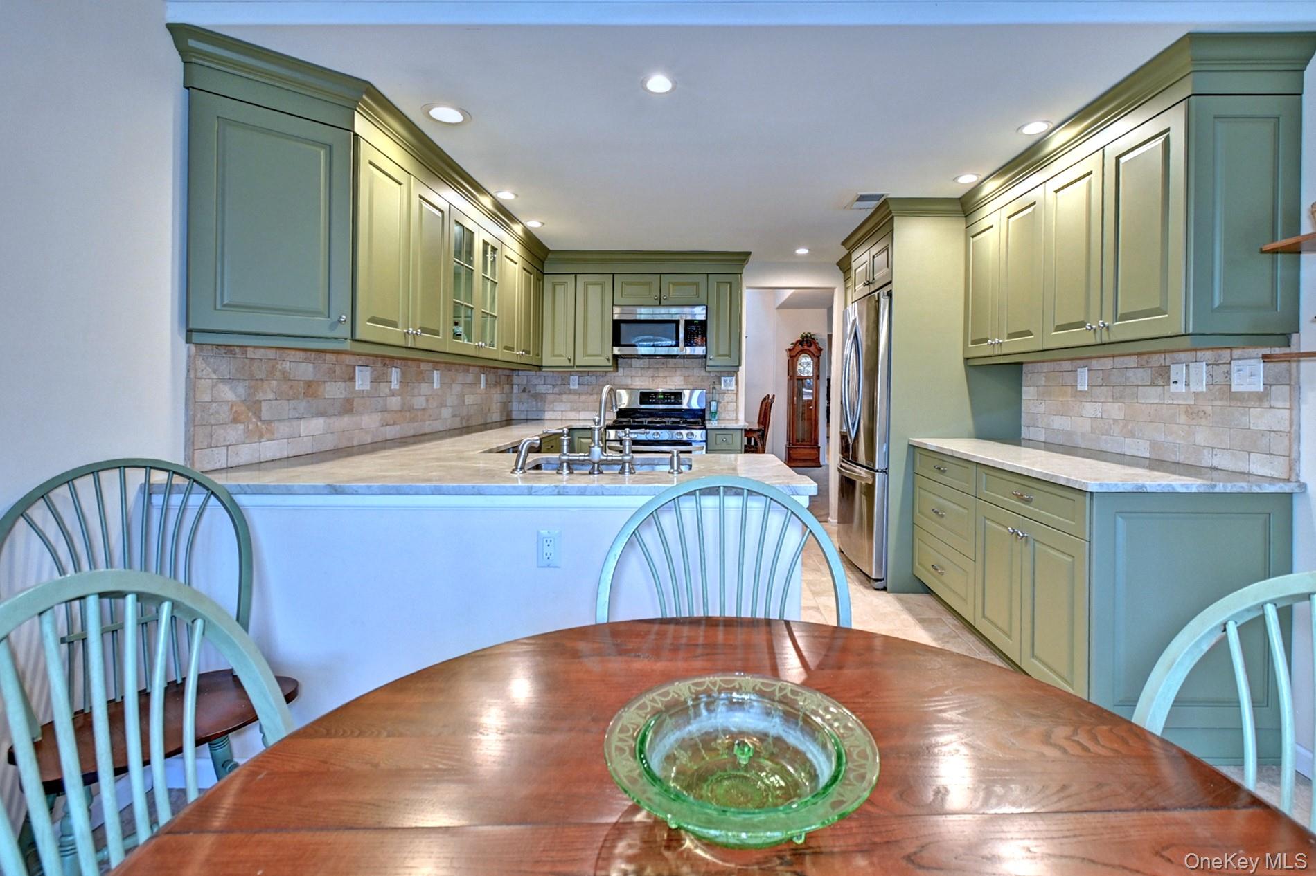 10 Oakdale Court Ridge, NY 11961 - Photo 12 of 41 a kitchen with sink and cabinets