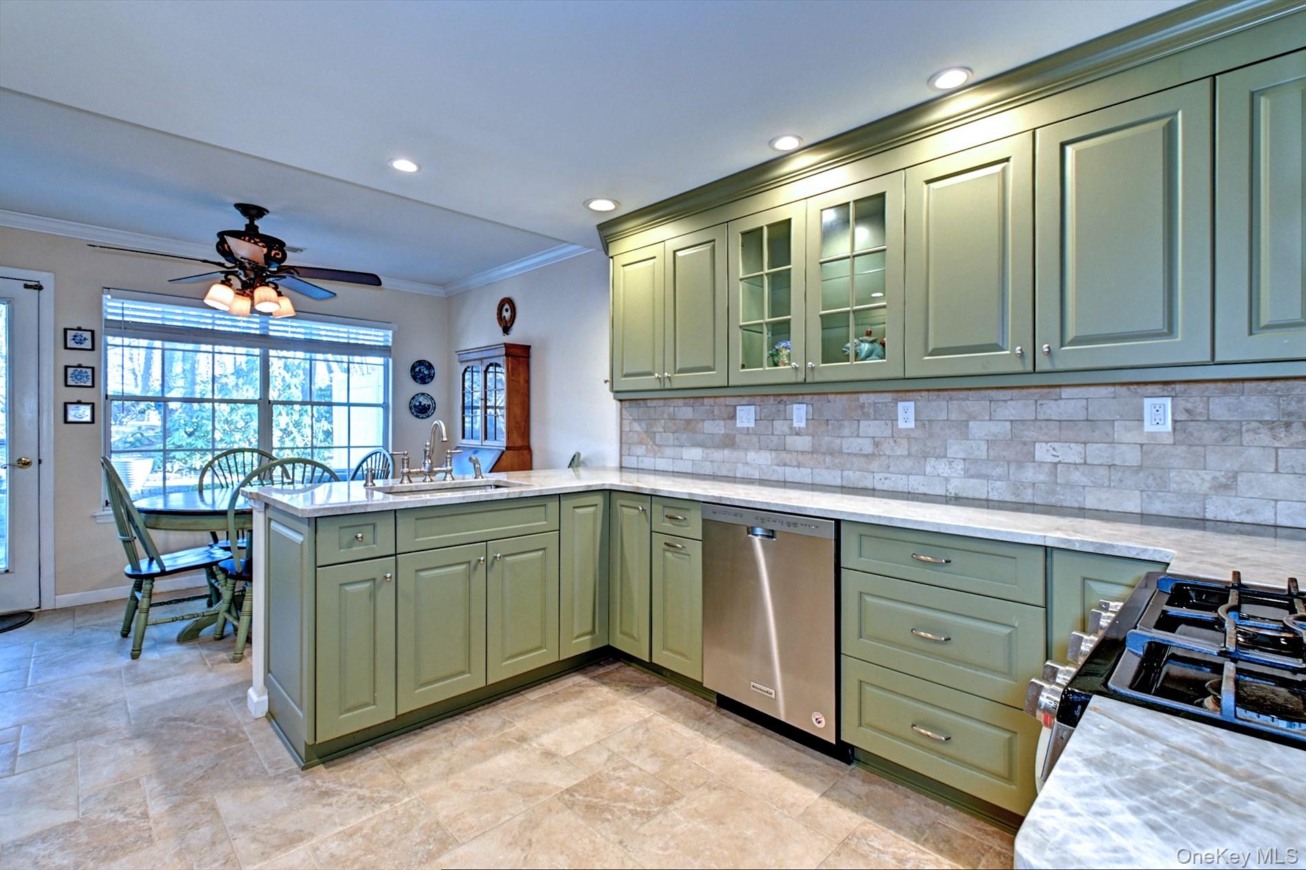 10 Oakdale Court Ridge, NY 11961 - Photo 15 of 41 a kitchen with stainless steel appliances granite countertop a sink and cabinets