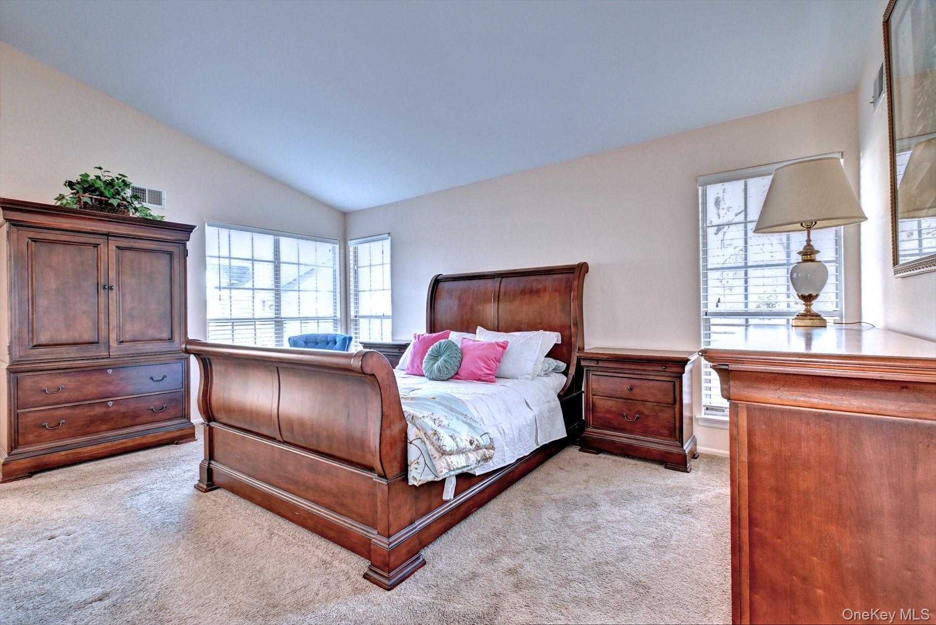 10 Oakdale Court Ridge, NY 11961 - Photo 16 of 41 a bedroom with a bed and window