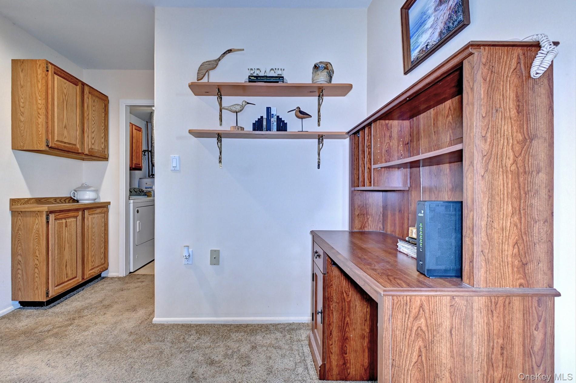 10 Oakdale Court Ridge, NY 11961 - Photo 20 of 41 a kitchen view with wooden cabinets and sink