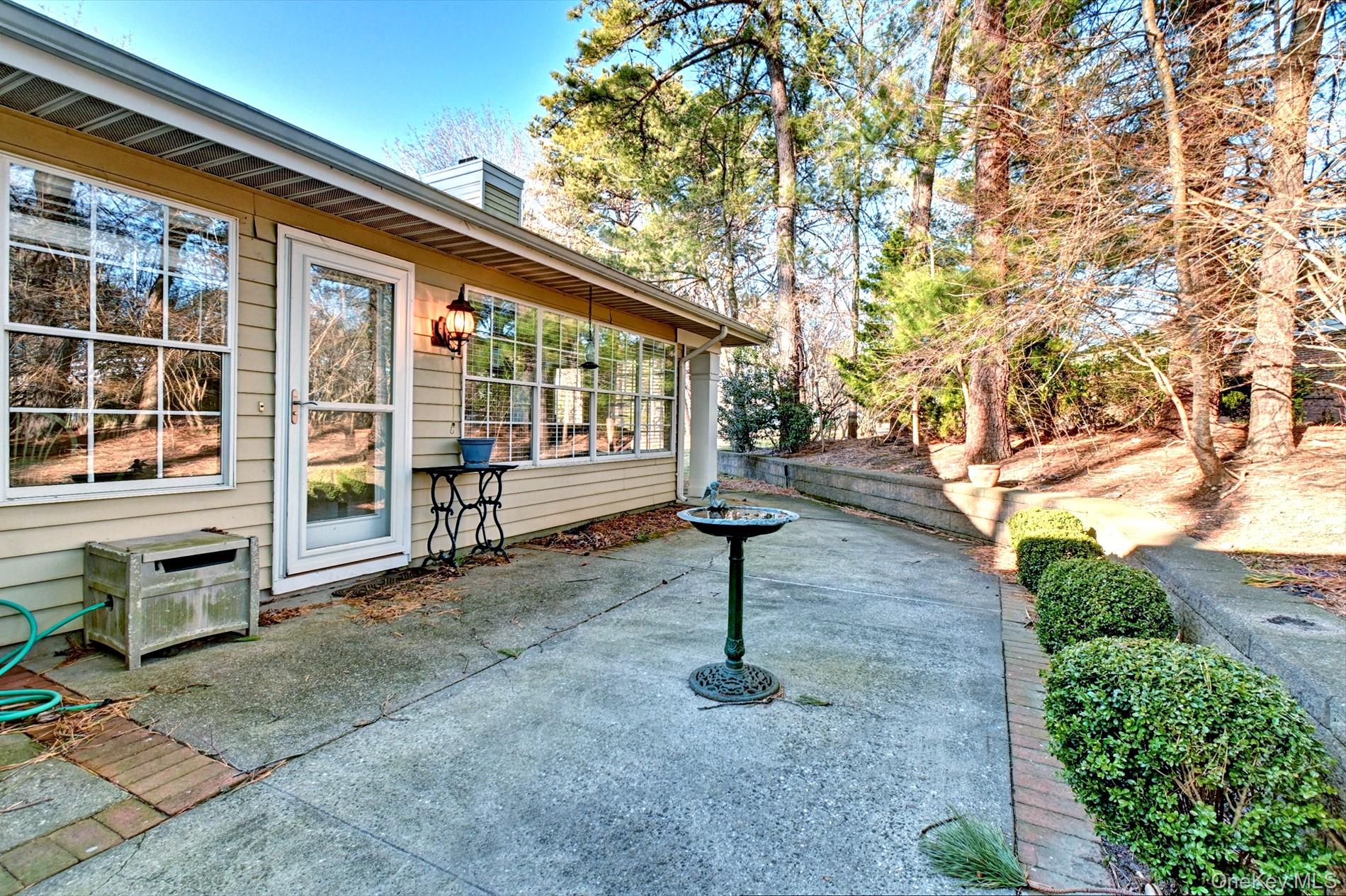 10 Oakdale Court Ridge, NY 11961 - Photo 24 of 41 a front view of a house with a yard
