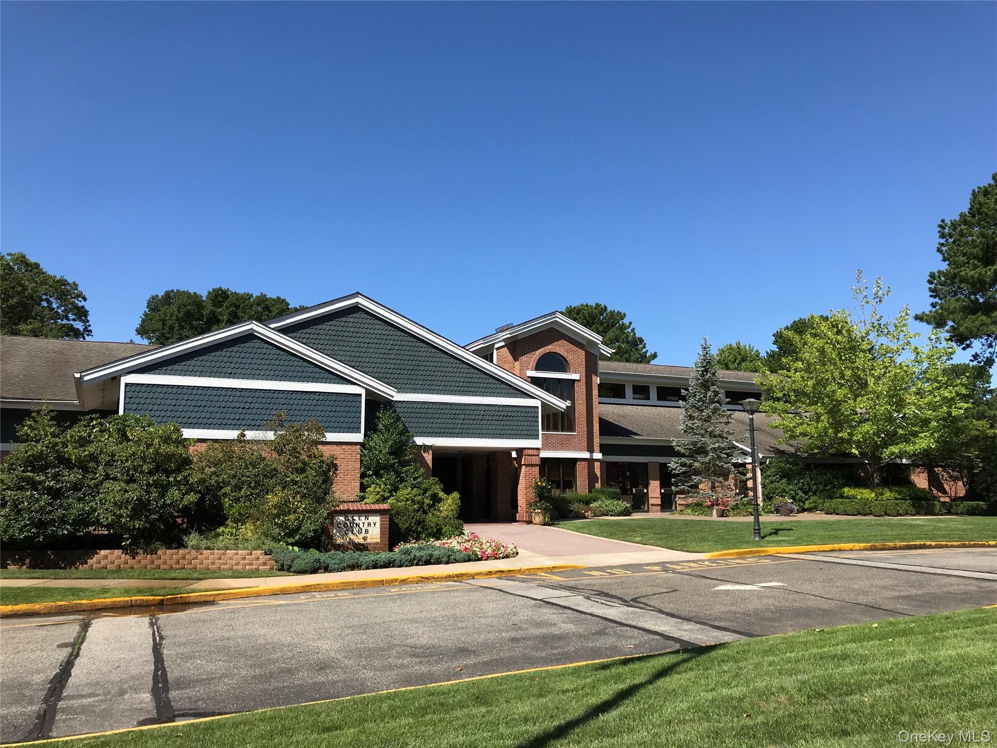 10 Oakdale Court Ridge, NY 11961 - Photo 25 of 41 a front view of a house with a yard