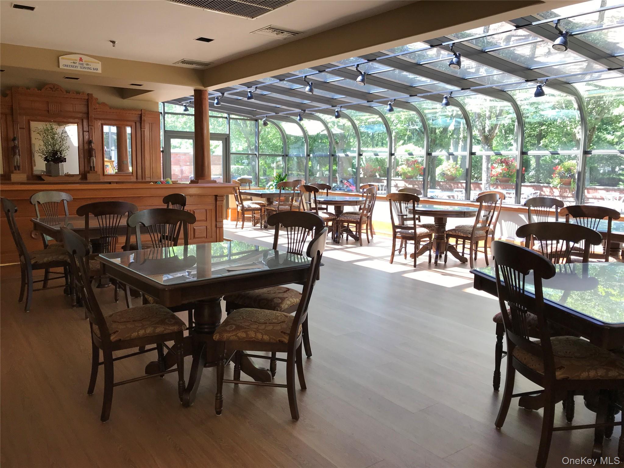 10 Oakdale Court Ridge, NY 11961 - Photo 27 of 41 a dining room with furniture window and outdoor view