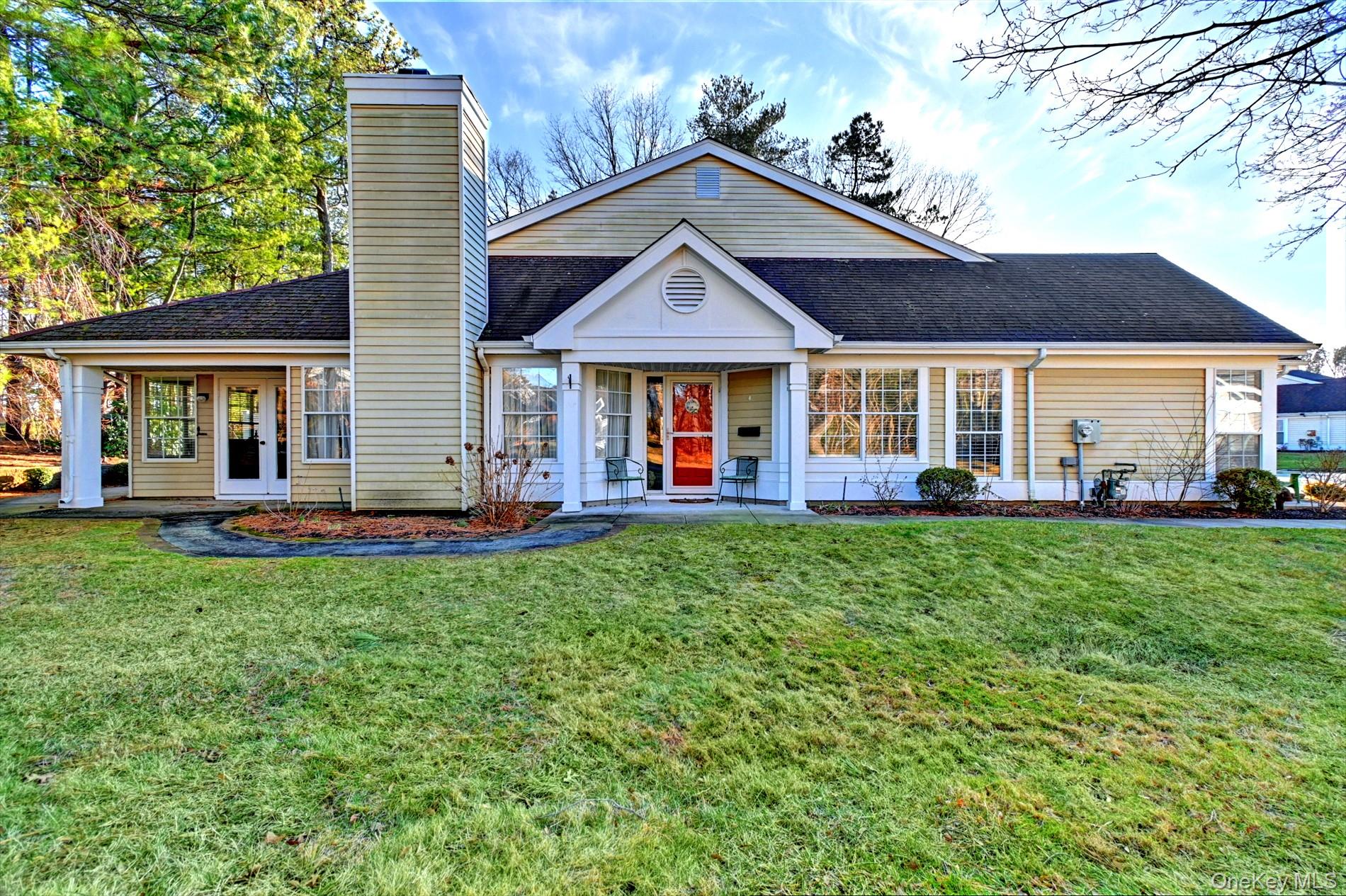 10 Oakdale Court Ridge, NY 11961 - Photo 4 of 41 a view of a house with a big yard plants and large trees