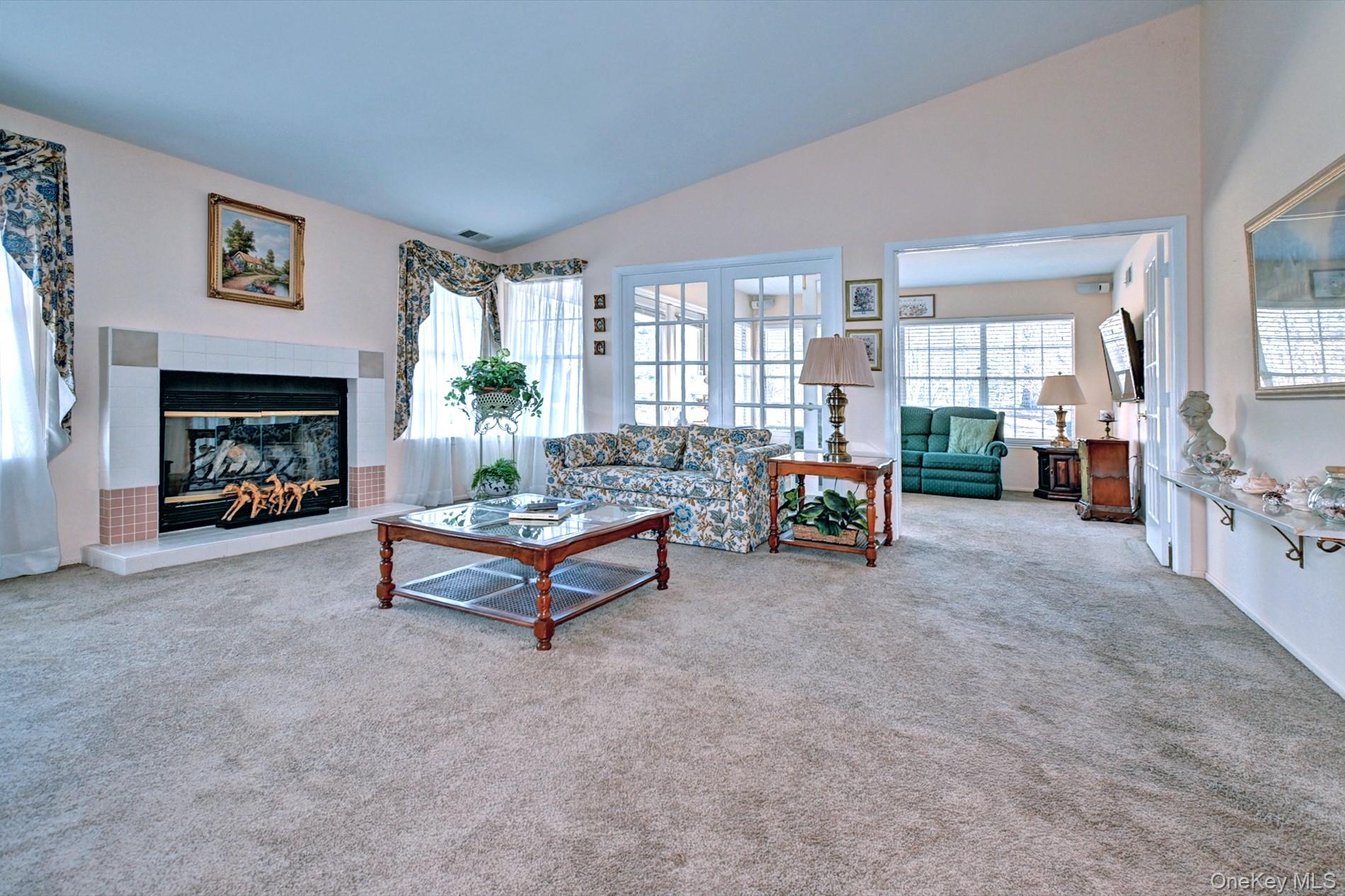 10 Oakdale Court Ridge, NY 11961 - Photo 5 of 41 a living room with furniture and a fireplace