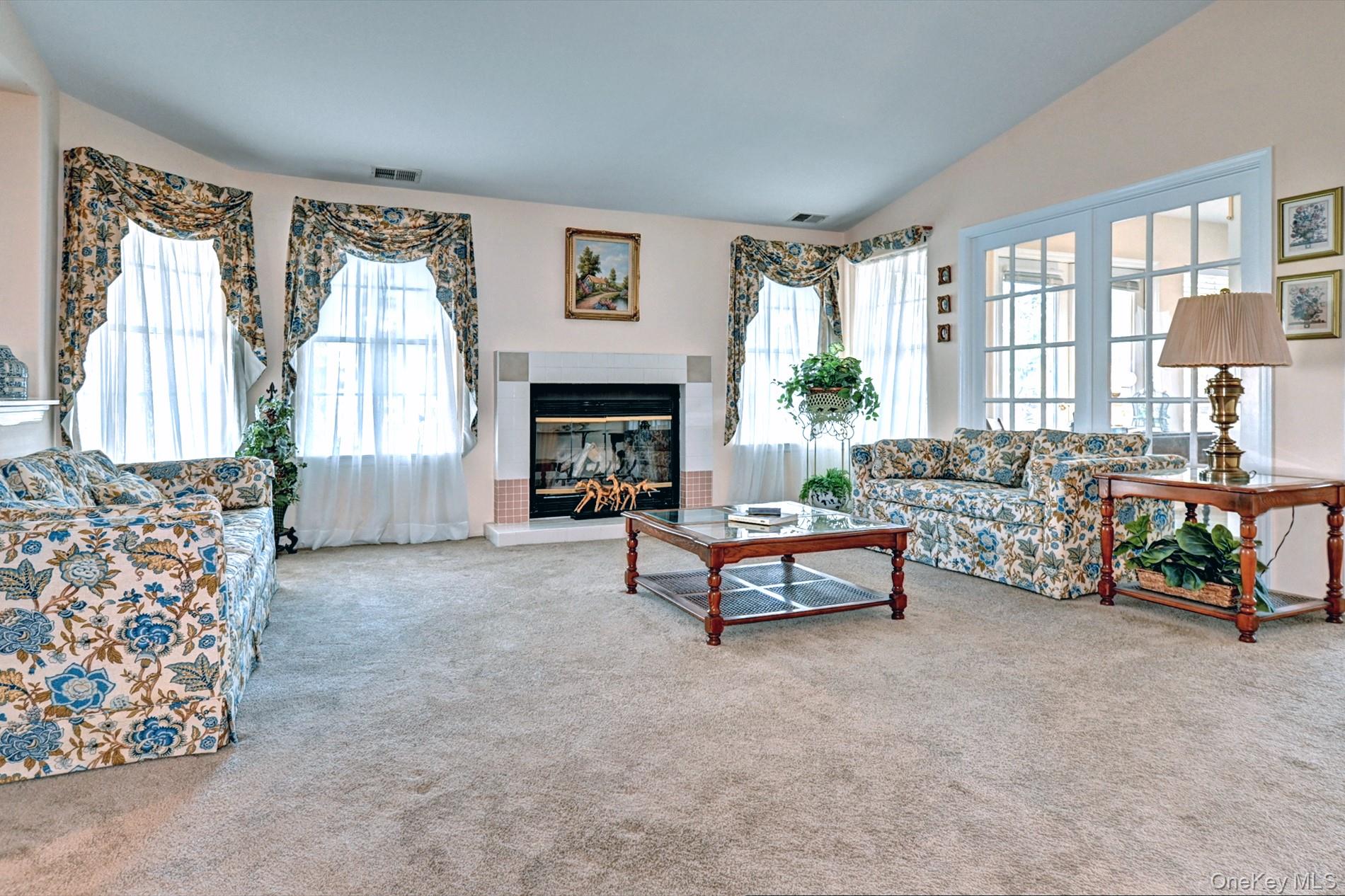 10 Oakdale Court Ridge, NY 11961 - Photo 6 of 41 a living room with furniture and a fireplace