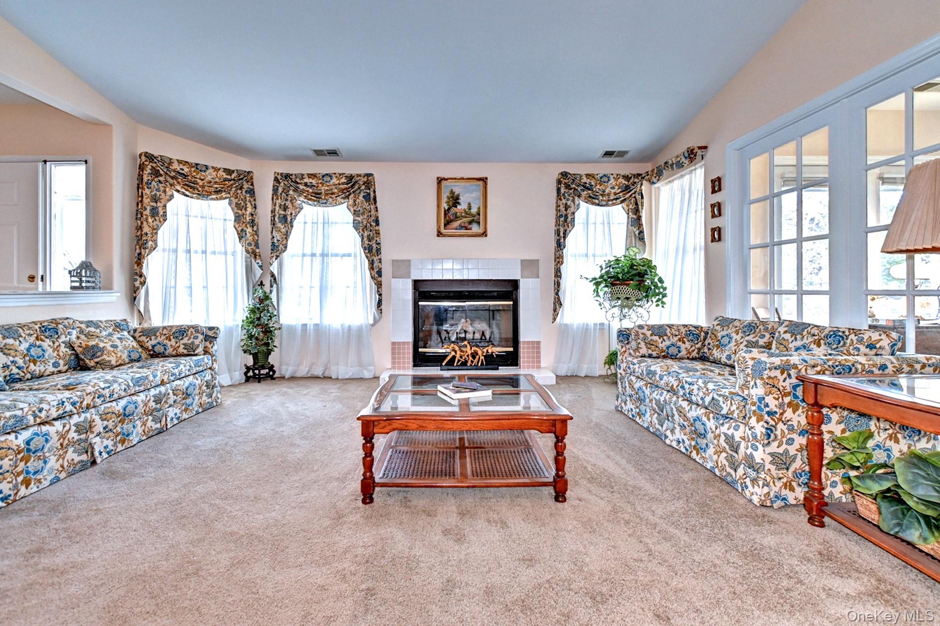10 Oakdale Court Ridge, NY 11961 - Photo 7 of 41 a living room with furniture and a fireplace