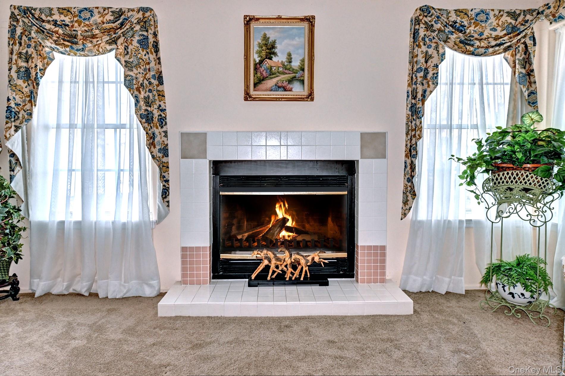 10 Oakdale Court Ridge, NY 11961 - Photo 8 of 41 a living room with furniture and a fireplace