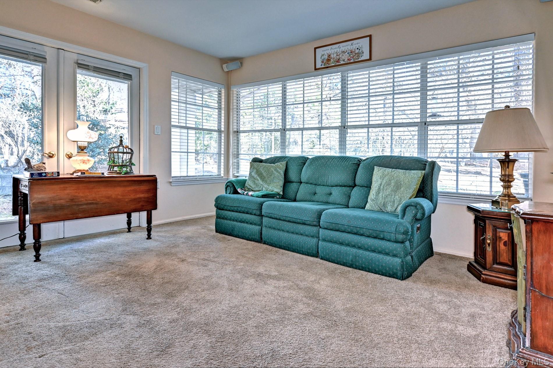 10 Oakdale Court Ridge, NY 11961 - Photo 9 of 41 a living room with furniture and a large window