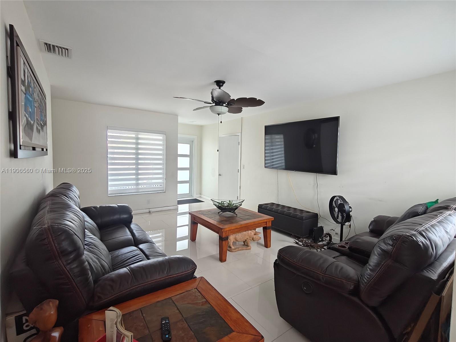 14444 Southwest 107th Terrace Miami, FL 33186 - Photo 21 of 73 a living room with furniture