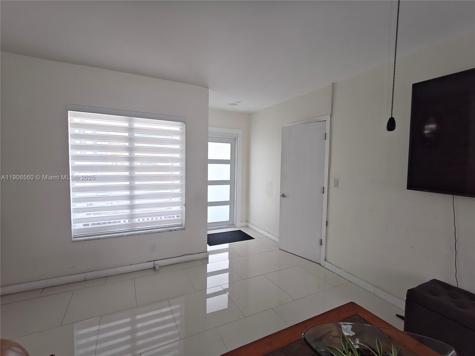 14444 Southwest 107th Terrace Miami, FL 33186 - Photo 22 of 73 a view of an empty room with a window