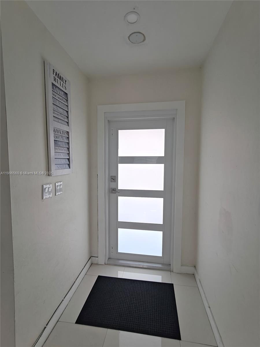 14444 Southwest 107th Terrace Miami, FL 33186 - Photo 25 of 73 a view of an empty room with a window